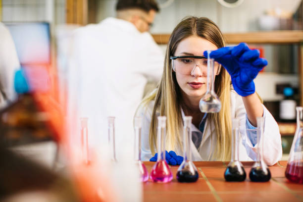 istock Young female Scientist at the laboratory experimenting with test tubes 1276777872