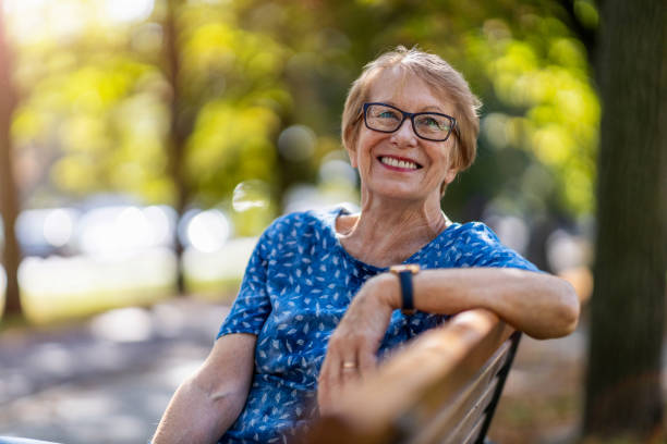 Beautiful senior woman outdoors in the city stock photo