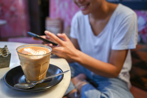 istock Woman using smart phone in cafe 1276779170