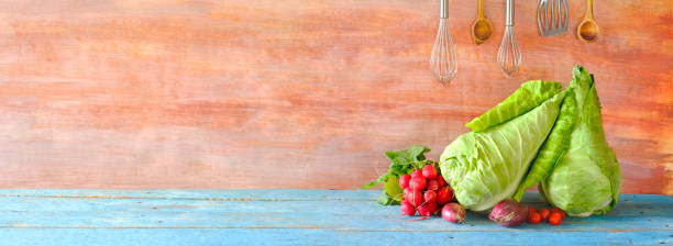 istock Sweetheart cabbage,kitchen utensils,tomatoes,onions, panoramic cooking concept with large copy space. 1276779765