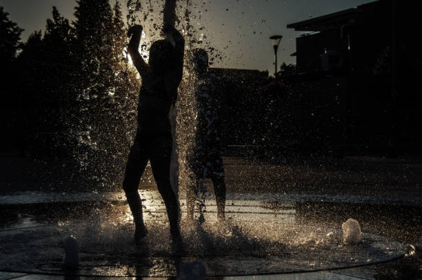 istock Playing in the city fountain 1276780549