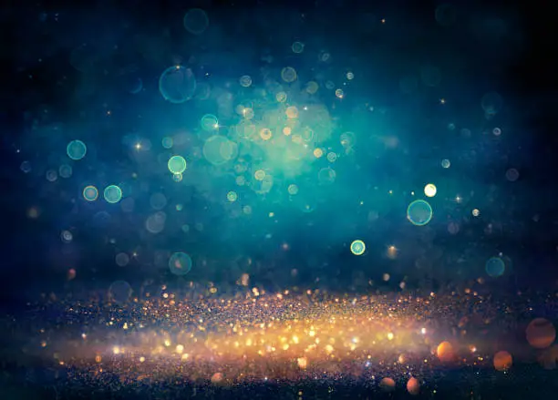 Photo of Abstract Glitter Background - Golden And Blue Defocused Lights - Vintage Filter