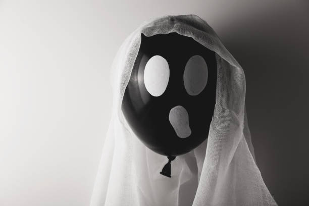 istock Black ball Halloween ghost decor. Minimalism and traditional celebration 1276782719