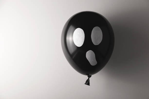 istock Black ball Halloween ghost decor. Minimalism and traditional celebration 1276782727