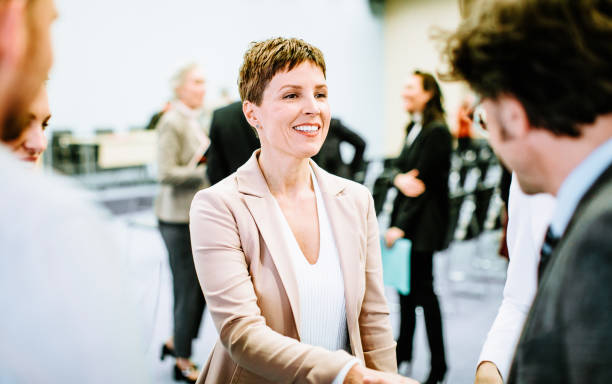 istock Business people at a conference event 1276782804