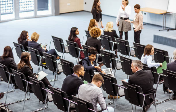 istock Business people at a conference event 1276783536