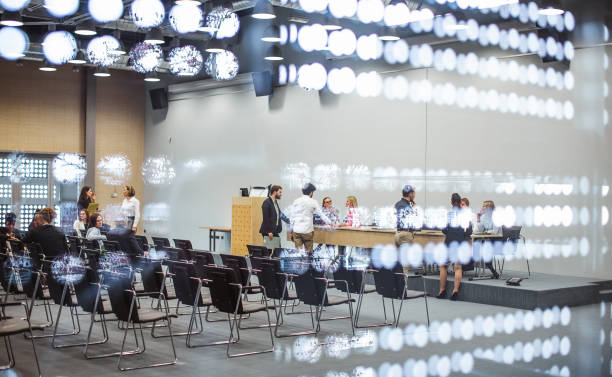 istock Business people at a conference event 1276783643