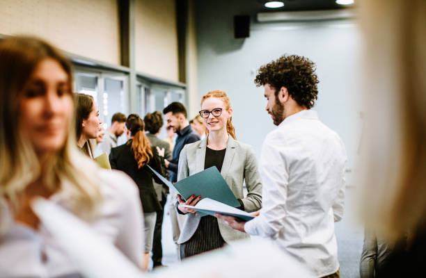 istock Business people at a conference event 1276783646