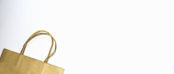 istock Brown paper bag isolated on white background 1276783942