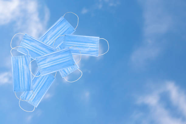 istock Blue mask floating in the sky 1276783968