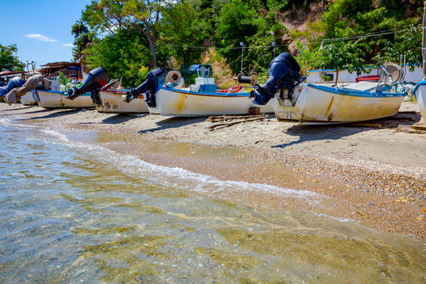 istock Motor boats are dry docked on the sandy, pebbles beach 1276784716