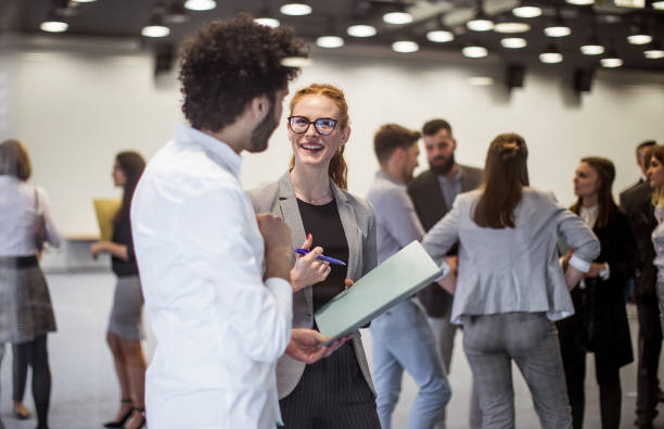 istock Business people at a conference event 1276785064