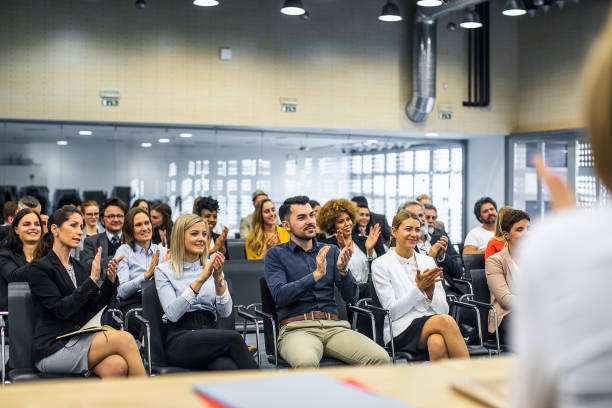 istock Business people at a conference clapping to the presenter 1276785948