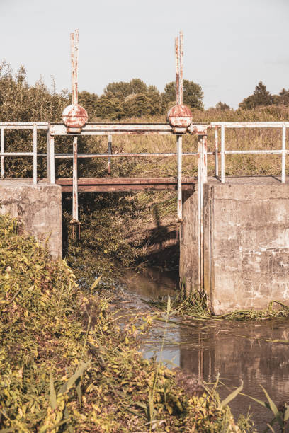 an old rusty lock was used to dam a river
