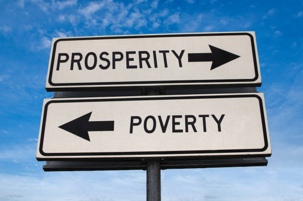 istock Prosperity versus poverty road sign with two arrows 1276787076