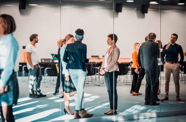 istock Business people at a conference event 1276787104
