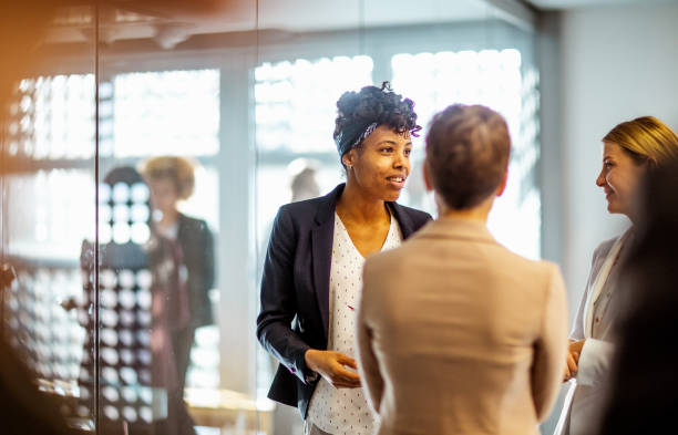 istock Business women discussing at a conference event 1276787297