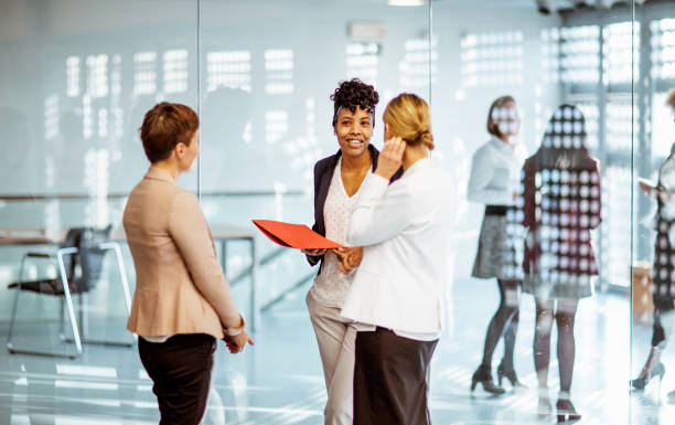 istock Business women discussing at a conference event 1276788463