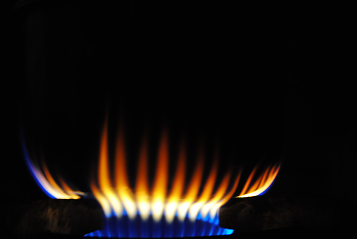 Blue Flames in Black (Gas Stove from side) , image not focus and blurred