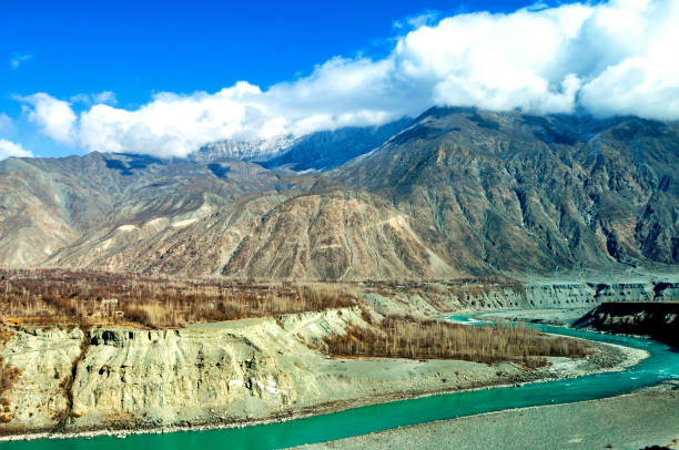 Famous Indus river in the karakoram mountains Winter scene of the Indus River and Snow-capped karakoram mountains near the Gilgit karakoram highway stock pictures, royalty-free photos & images