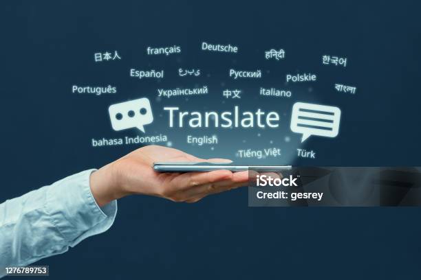 The Concept Of A Program For Translating In A Smartphone From Different Languages Stock Photo - Download Image Now