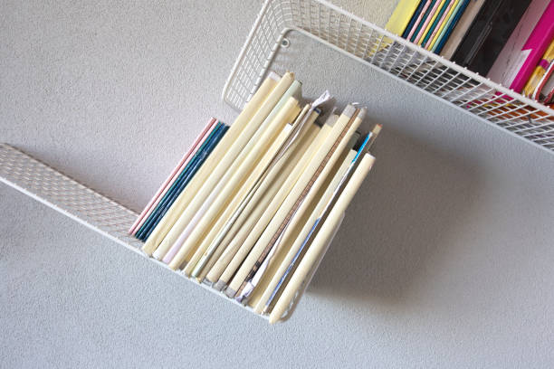 istock Modern iron rack bookshelf hanging on the wall with school books modern retro design 1276790950