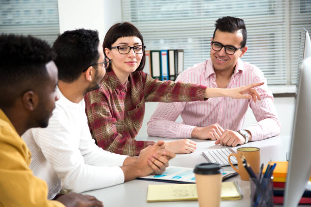 istock Multy-ethnic group of creative business people working with computer at office 1276791236