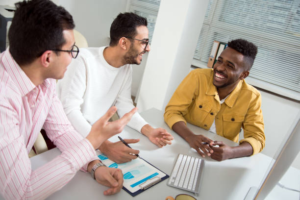 istock Multy-ethnic group of creative business people working with computer at office 1276791244