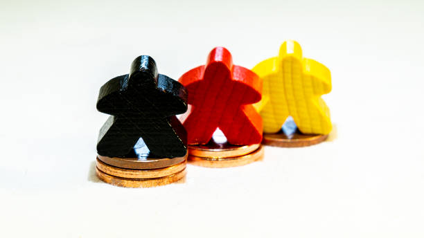 istock Coins stacks with figures in yellow red black 1276792140