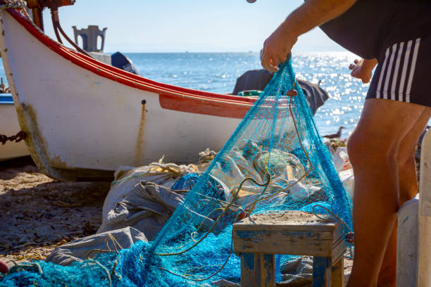 istock Fisher pile up fishing net at sandy beach 1276795846