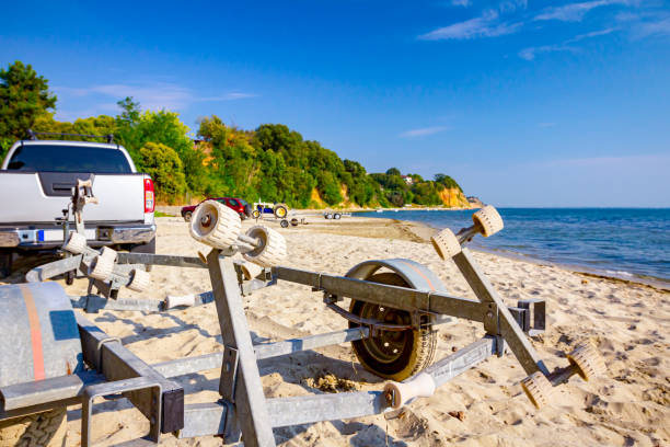 istock Unloading small motor boats in sea water 1276796259