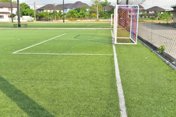 istock white line football corner on green field 1276799478