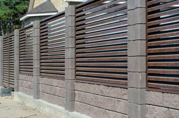 istock Blinds fence with gray stone columns. 1276802344
