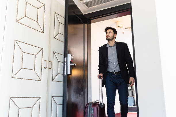 istock Business man carrying suitcase 1276803916