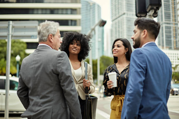 istock Business Associates Talking Outdoors in Downtown Miami 1276803956