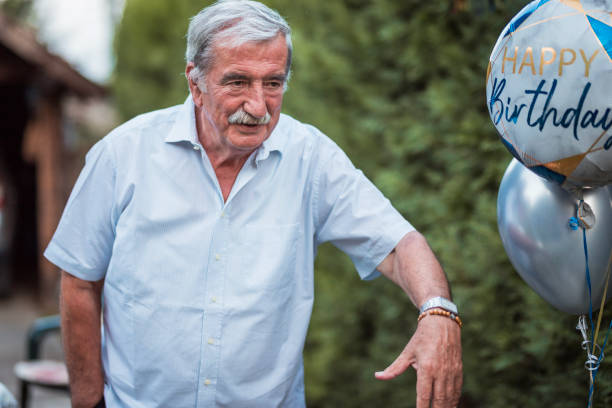 istock Happy grandfather celebrating birthday 1276806176