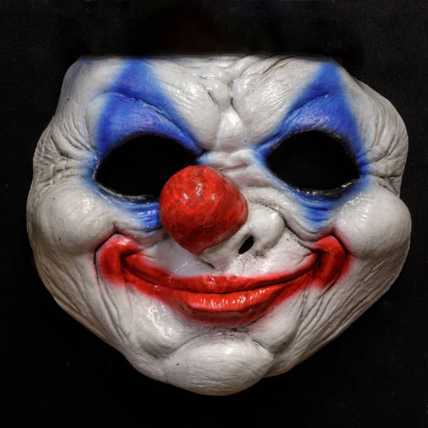 istock Vintage Clown Halloween Mask Isolated on Black Background 1276807145