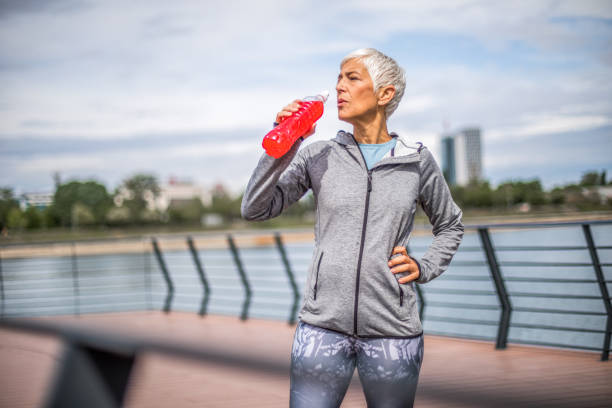 istock Beautiful senior woman exercise by the river. 1276810033
