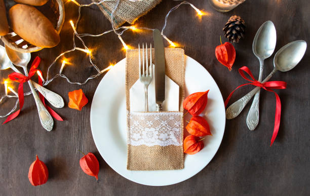 istock Thanksgiving dinner with family. Table setting in autumn style. 1276811233