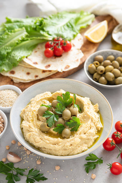 istock Chickpea hummus with green olives 1276813595