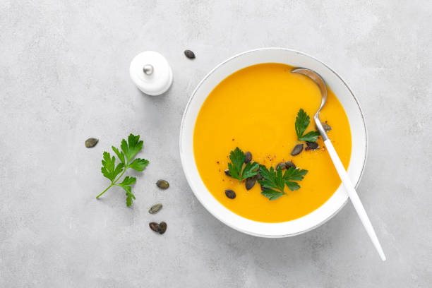 istock Vegan pumpkin soup with garlic and parsley 1276813612