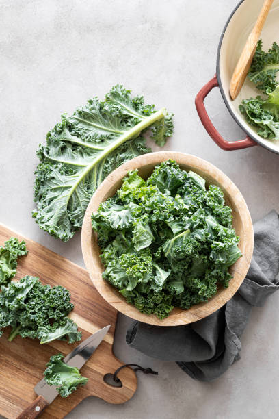 istock Fresh kale curly leaves, superfood 1276814214