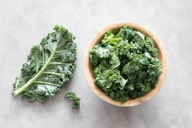istock Fresh kale curly leaves, superfood 1276814313