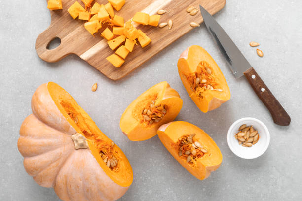 istock Fresh raw sliced butternut squash on wooden board, top down view 1276814416