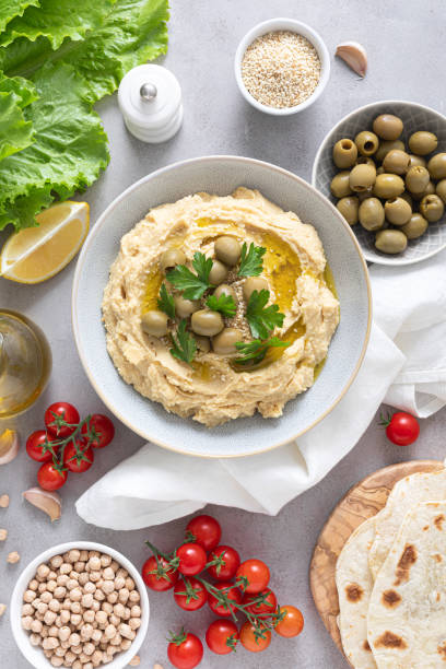 istock Chickpea hummus with green olives 1276814654