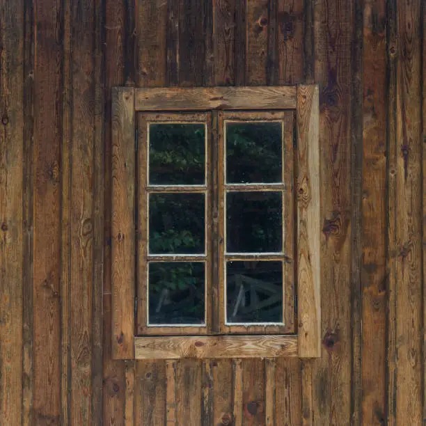beautiful antique window in a wooden house in the open-air museum of the Polish countryside