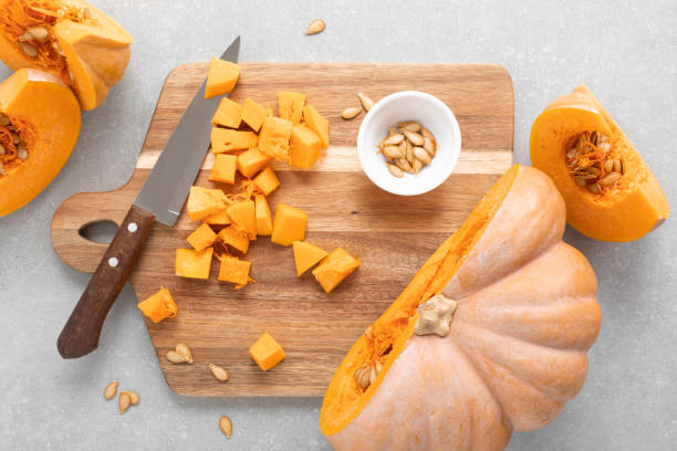 istock Fresh raw sliced butternut squash on wooden board, top down view 1276815486