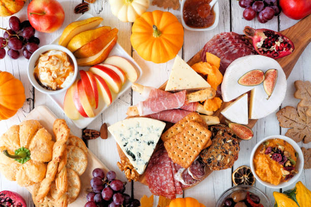 istock Fall charcuterie table scene against a white wood background 1276817269