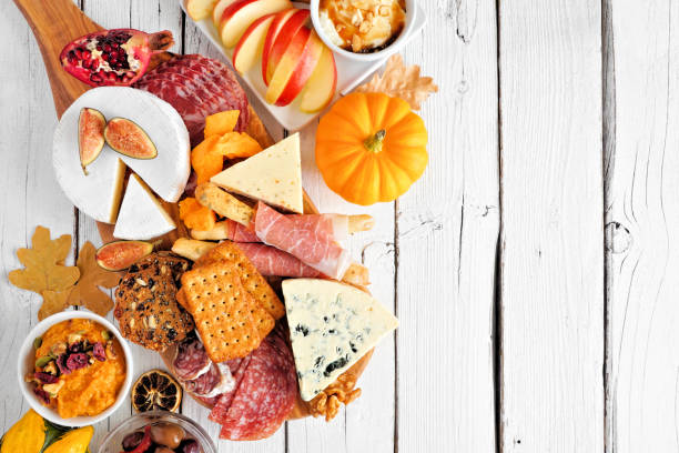 istock Autumn theme charcuterie side border against a white wood background 1276818155