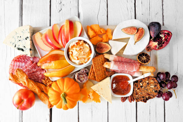 istock Autumn appetizer board, top view against a white wood background 1276818223